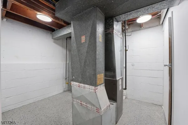 a view of a house with a yard and a bench