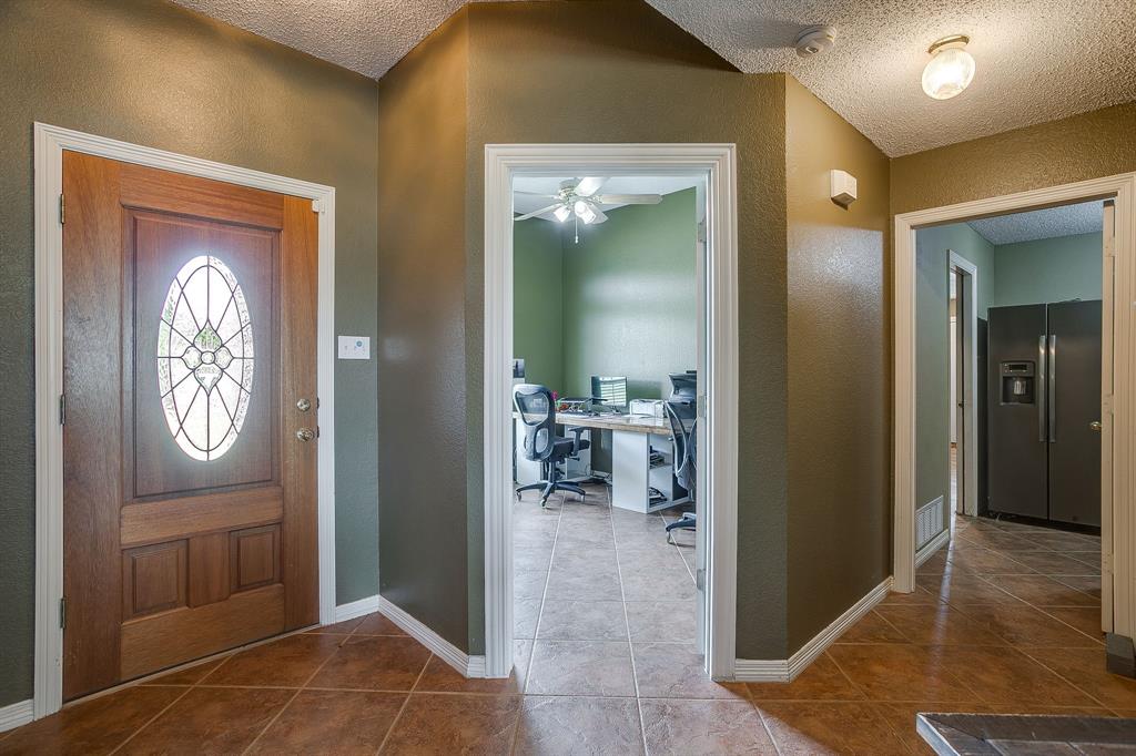 1050 Hampel Road Palmer, TX 75152 - Photo 6 of 35 a view of a hallway with wooden floor windows and a bathroom