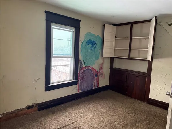 a room with window and closet