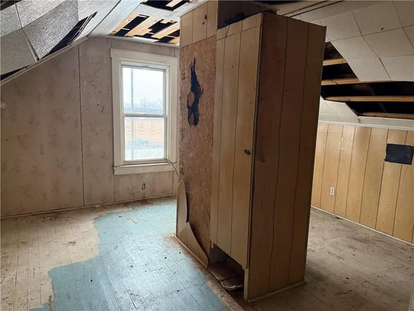 a view of an empty room and a window