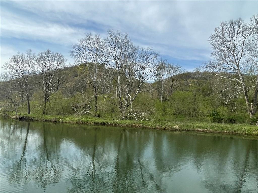 a view of lake with green space