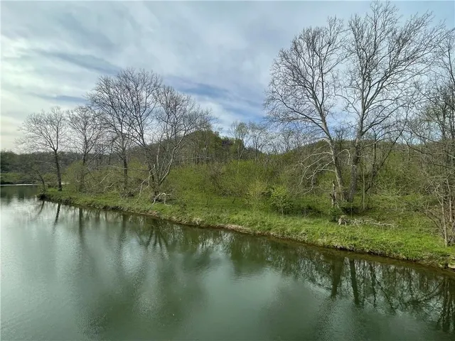 a view of lake with green space