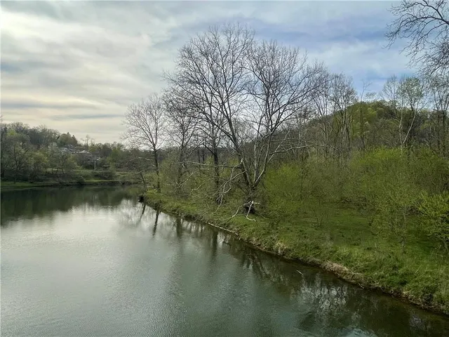 a view of lake with green space