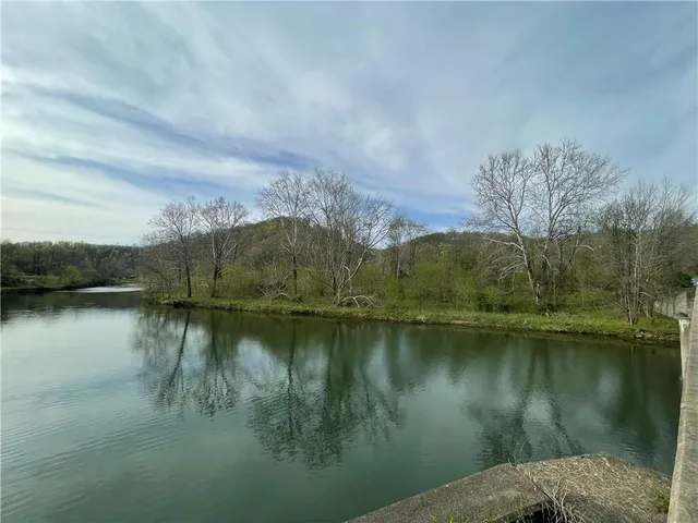 a view of lake with green space