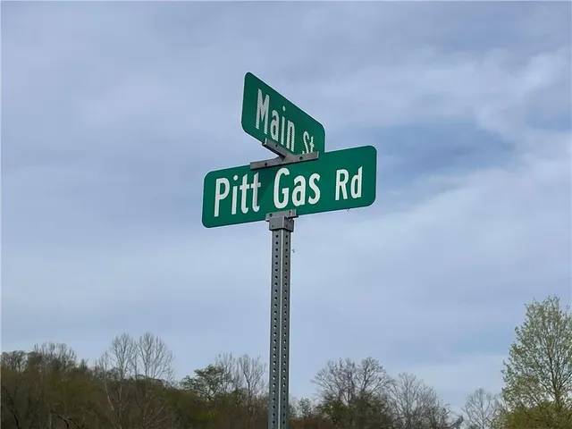 a street sign sitting on top of a pole