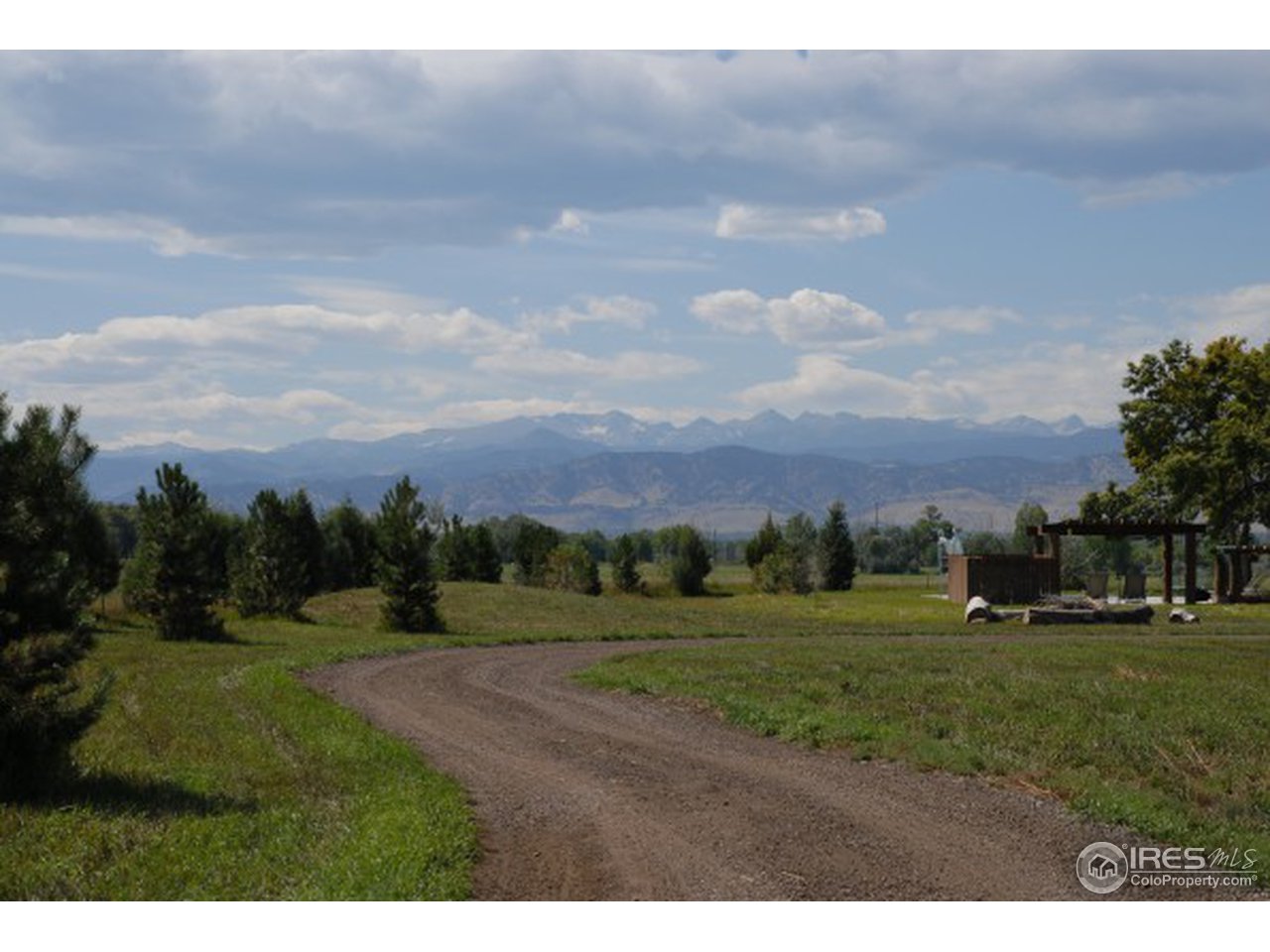7861 Valmont Road Boulder, CO 80301 - Photo 12 of 13 a view of a grassy field with trees