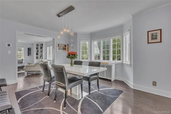 a kitchen with stainless steel appliances a sink a stove a refrigerator and cabinets