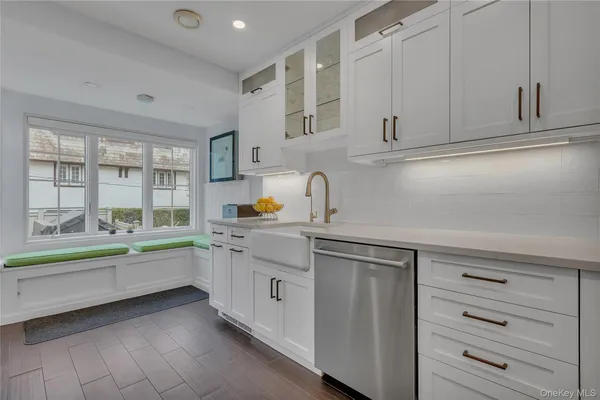 a view of a dining room with furniture and a potted plant