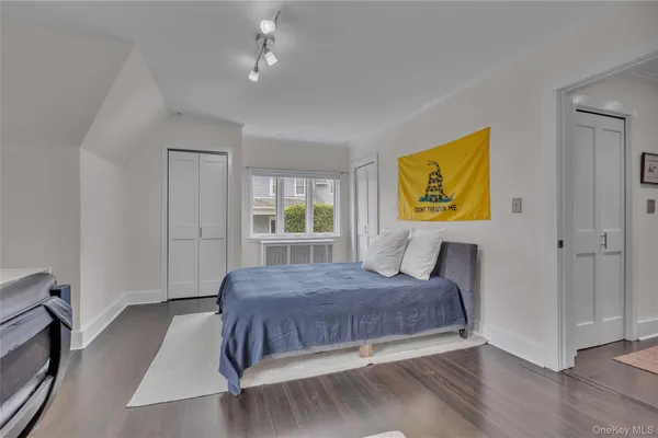 a spacious bathroom with a toilet sink and mirror