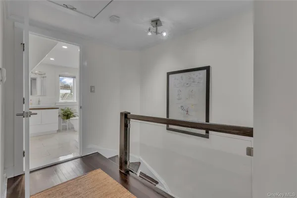 a bathroom with a toilet a sink and a mirror