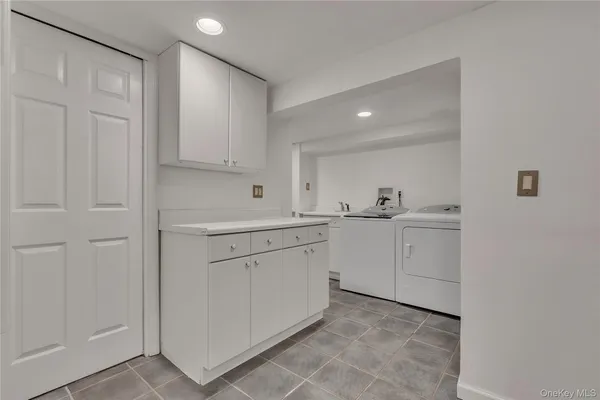 a bathroom with a toilet a sink and a mirror