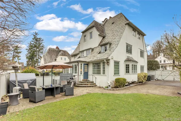 an aerial view of a house with outdoor space