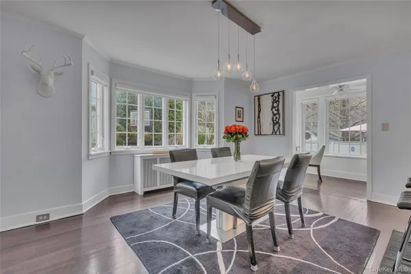 a kitchen with kitchen island granite countertop a sink stainless steel appliances and cabinets