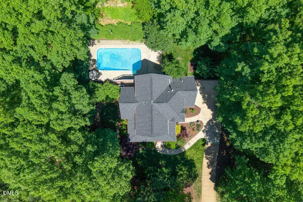 an aerial view of a house with outdoor space and street view