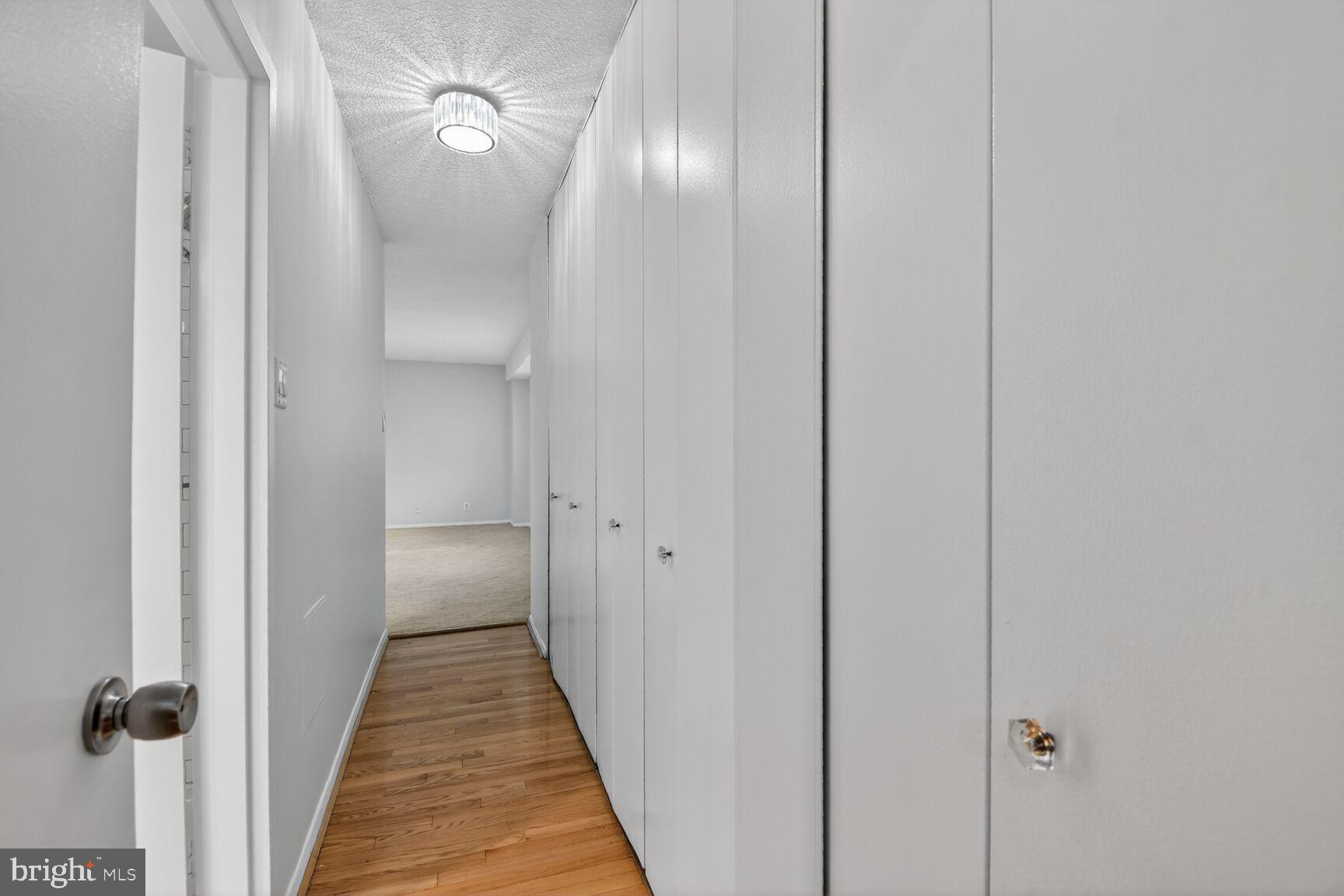5500 Friendship Boulevard, Unit 1714N Chevy Chase, MD 20815 - Photo 13 of 53 a view of a hallway with wooden floor
