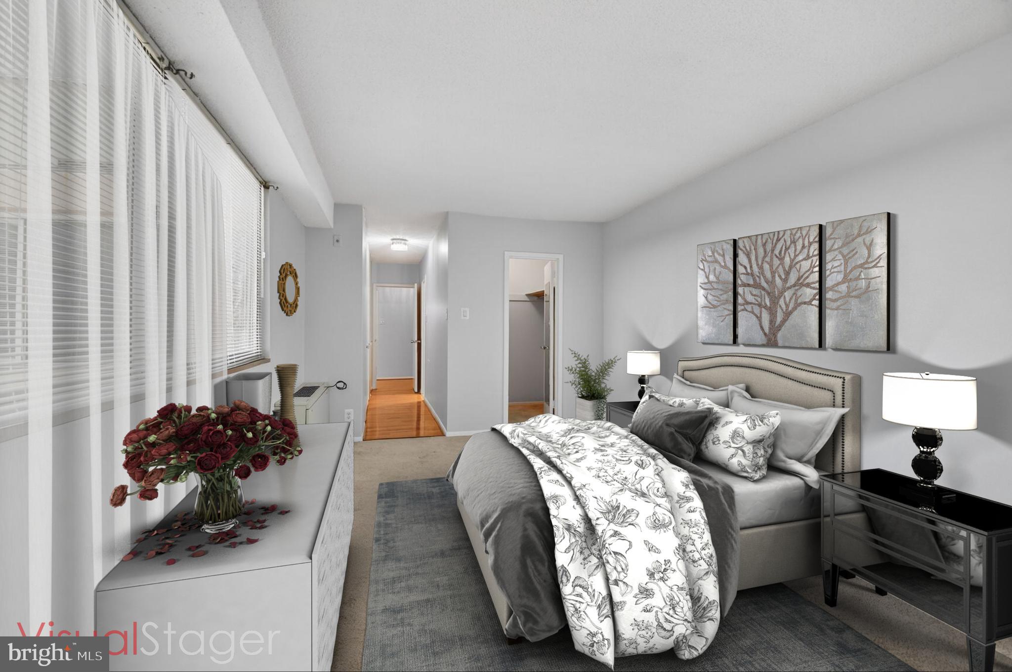 5500 Friendship Boulevard, Unit 1714N Chevy Chase, MD 20815 - Photo 14 of 53 a bedroom with a bed and a couch