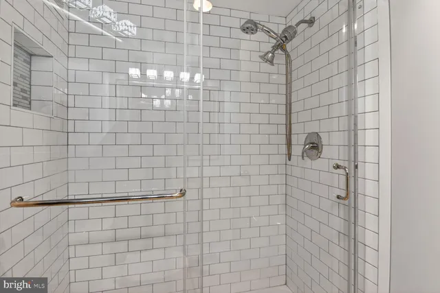 a view of a tall building next to a road