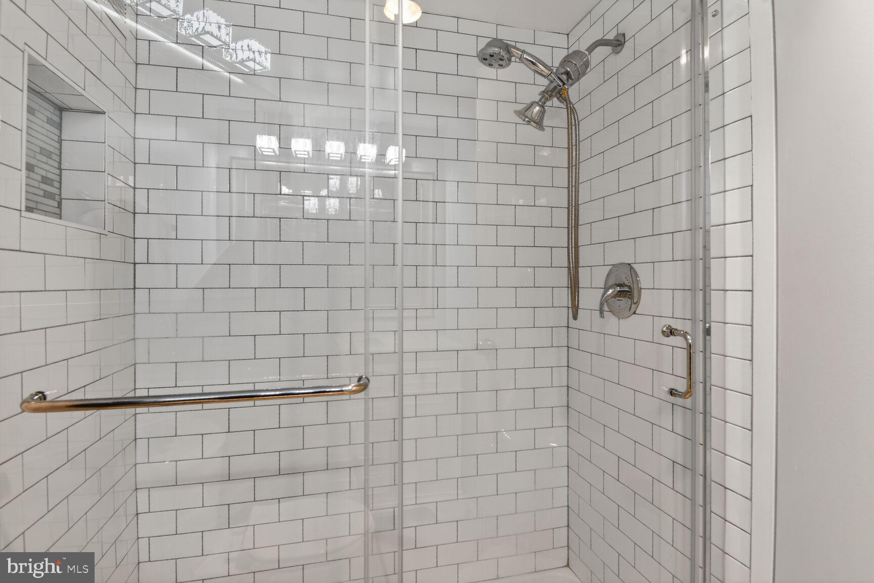 5500 Friendship Boulevard, Unit 1714N Chevy Chase, MD 20815 - Photo 17 of 53 a bathroom with a shower