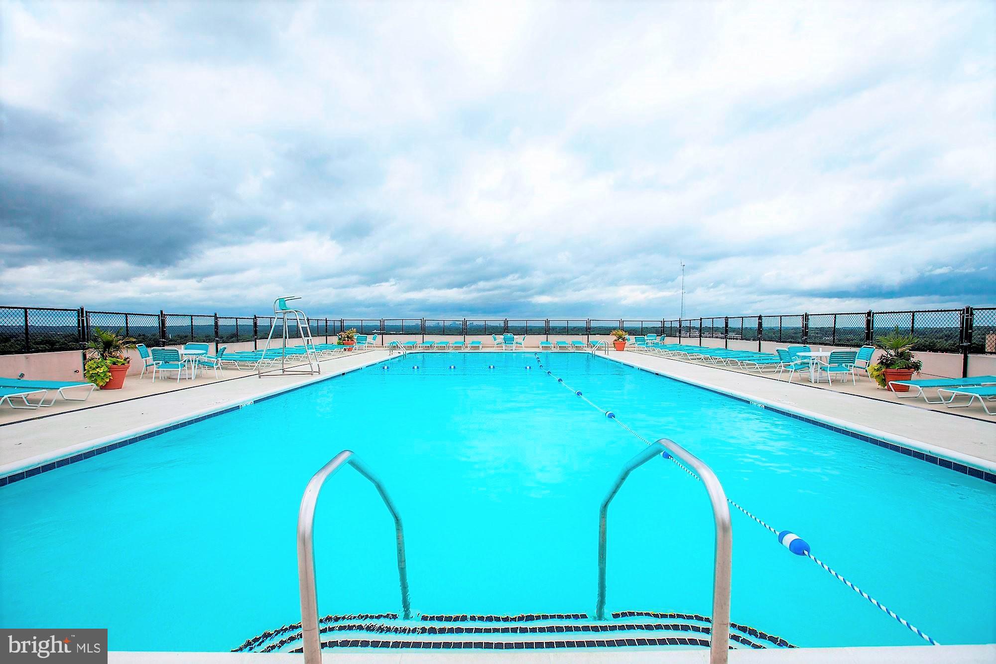 5500 Friendship Boulevard, Unit 1714N Chevy Chase, MD 20815 - Photo 37 of 53 a view of a swimming pool with a yard