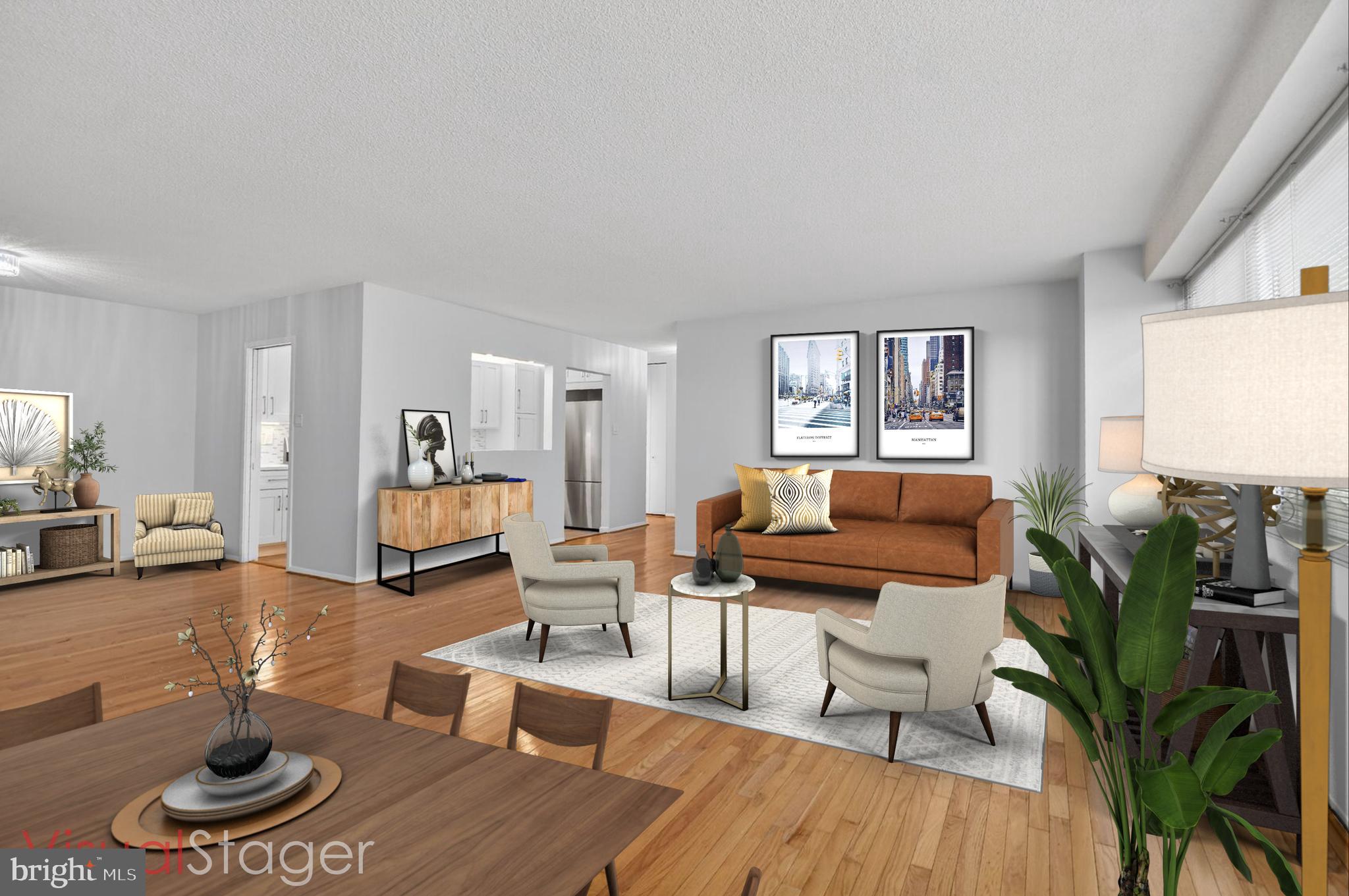 5500 Friendship Boulevard, Unit 1714N Chevy Chase, MD 20815 - Photo 5 of 53 a living room with furniture and a wooden floor