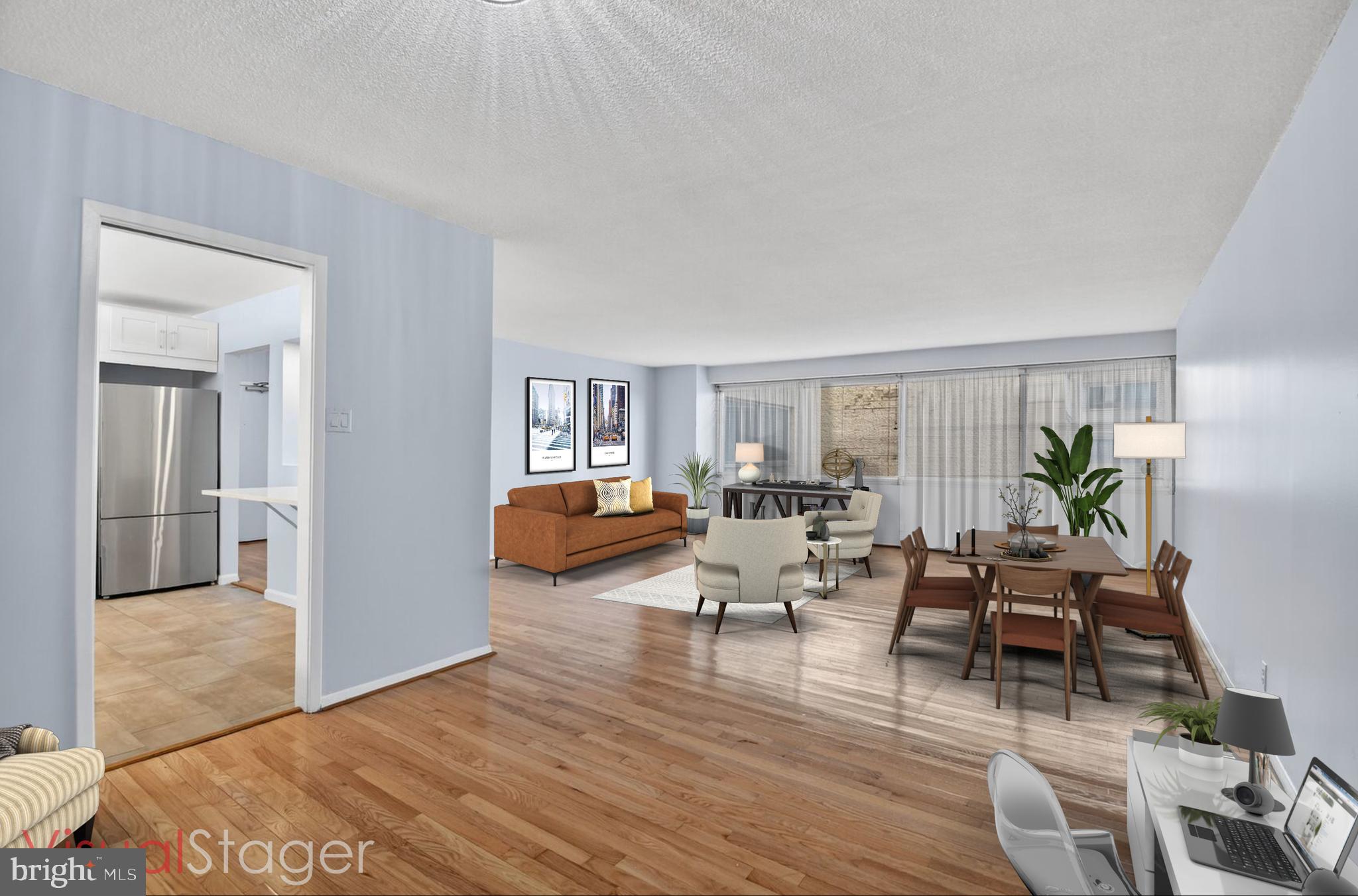 5500 Friendship Boulevard, Unit 1714N Chevy Chase, MD 20815 - Photo 7 of 53 a living room with furniture and a wooden floor