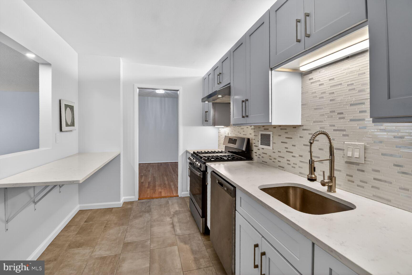 5500 Friendship Boulevard, Unit 1714N Chevy Chase, MD 20815 - Photo 9 of 53 a kitchen with stainless steel appliances granite countertop a sink stove and refrigerator