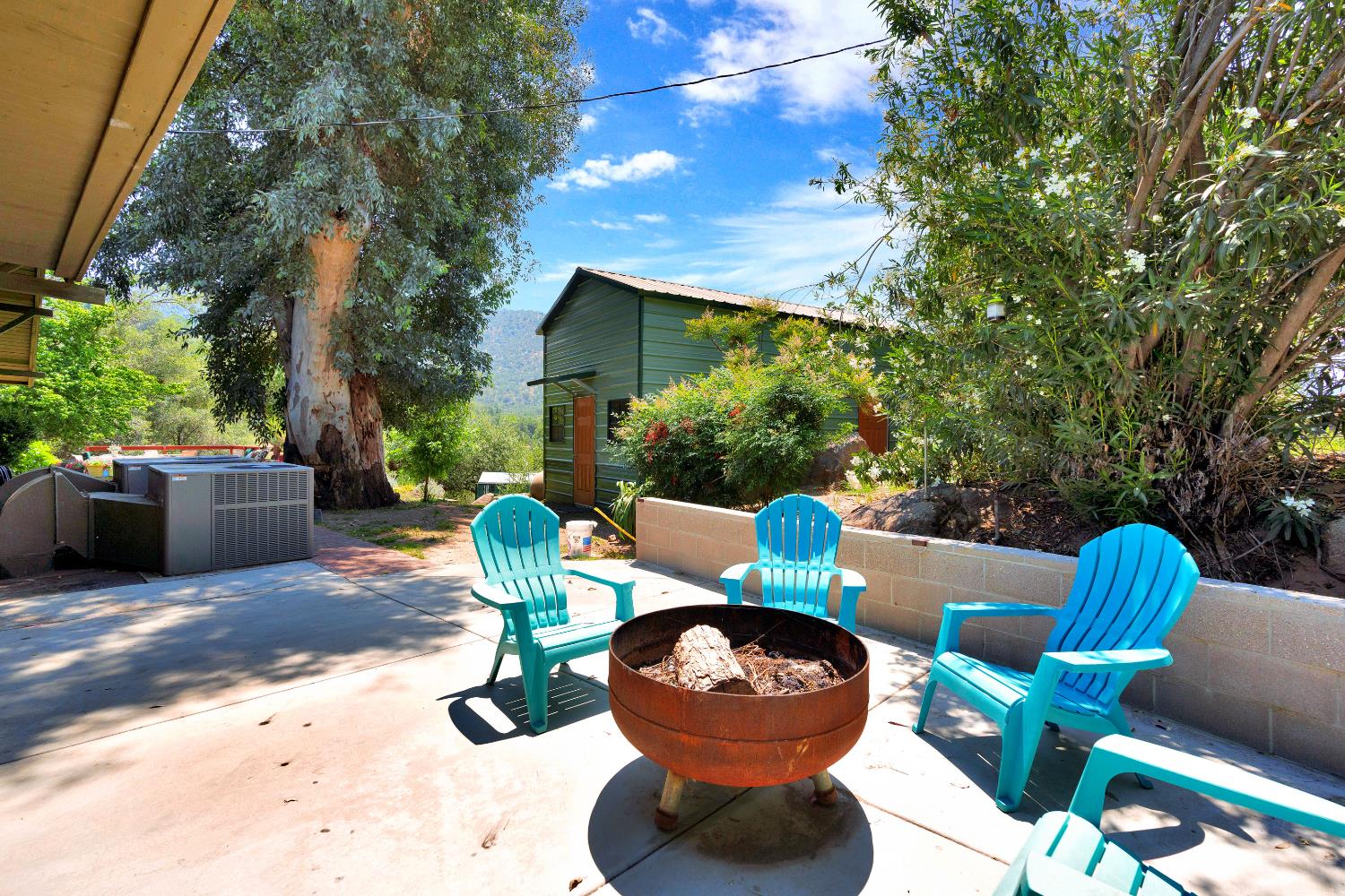 43715 Dinely Drive Three Rivers, CA 93271 - Photo 11 of 51 a view of a chairs and table in backyard