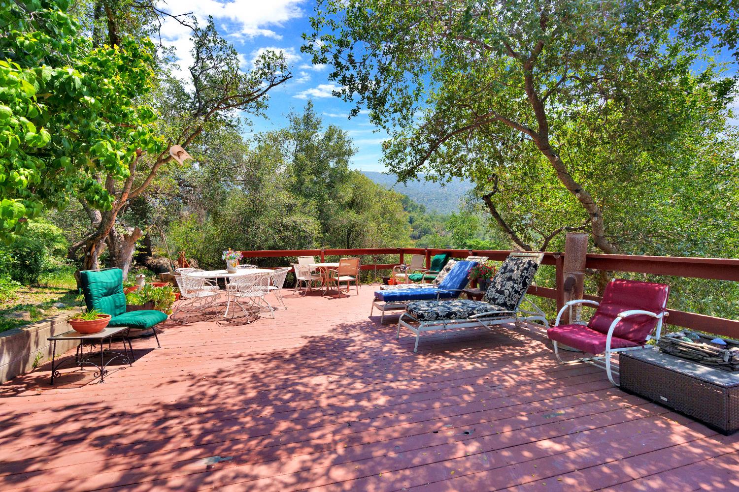 43715 Dinely Drive Three Rivers, CA 93271 - Photo 14 of 51 a view of a patio with a table and chairs under an umbrella