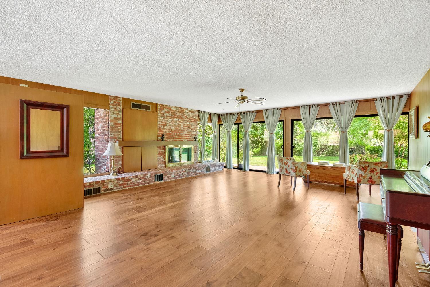43715 Dinely Drive Three Rivers, CA 93271 - Photo 31 of 51 a view of empty room with wooden floor and floor to ceiling window