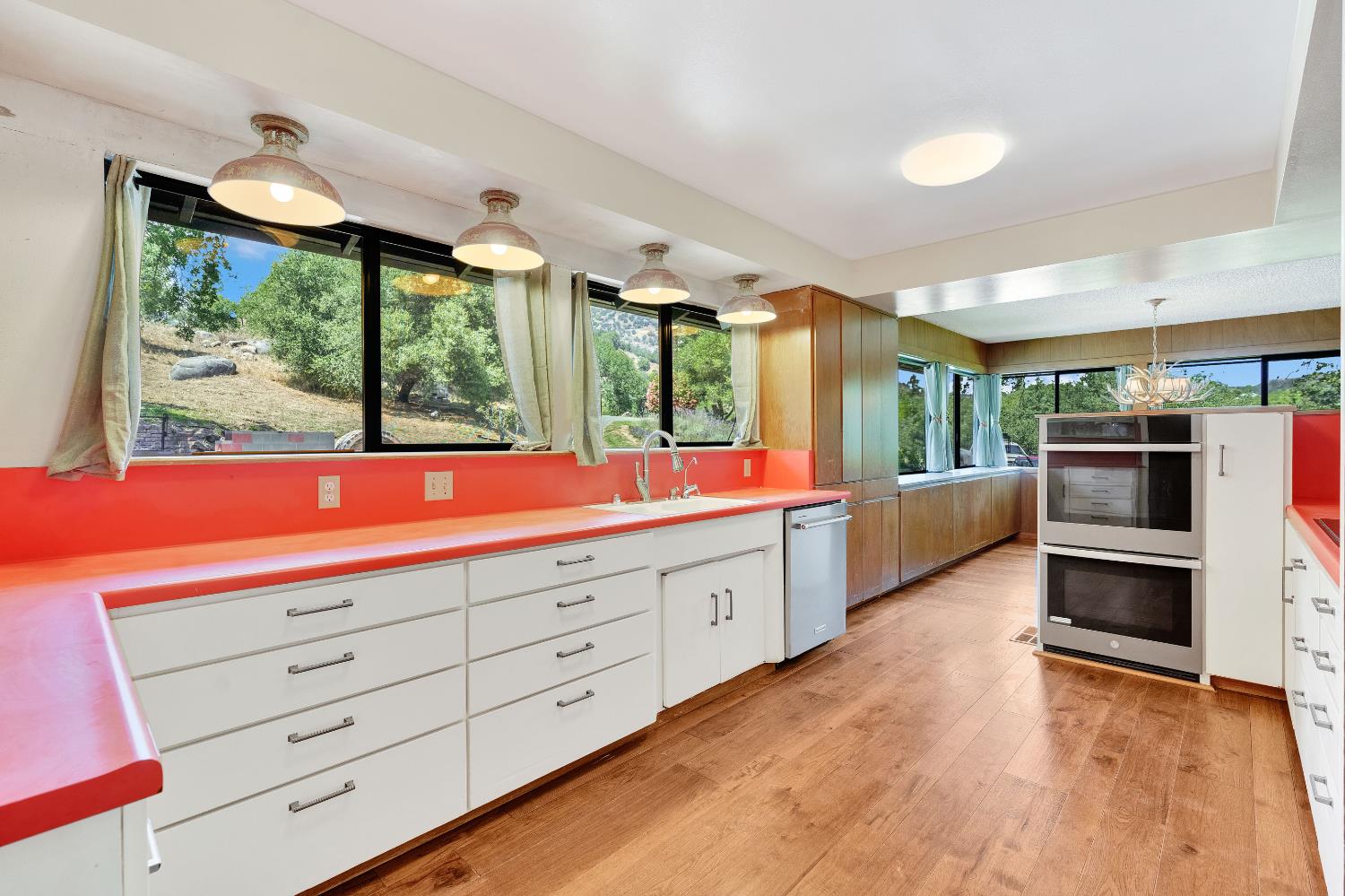 43715 Dinely Drive Three Rivers, CA 93271 - Photo 40 of 51 a kitchen with stainless steel appliances kitchen island granite countertop a large window and cabinets