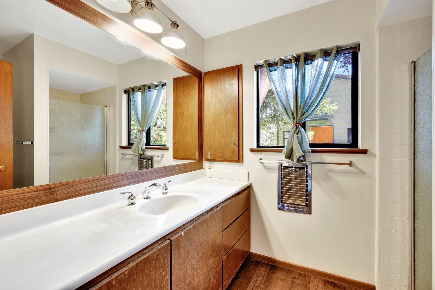 43715 Dinely Drive Three Rivers, CA 93271 - Photo 50 of 51 a bathroom with a double vanity sink and mirror