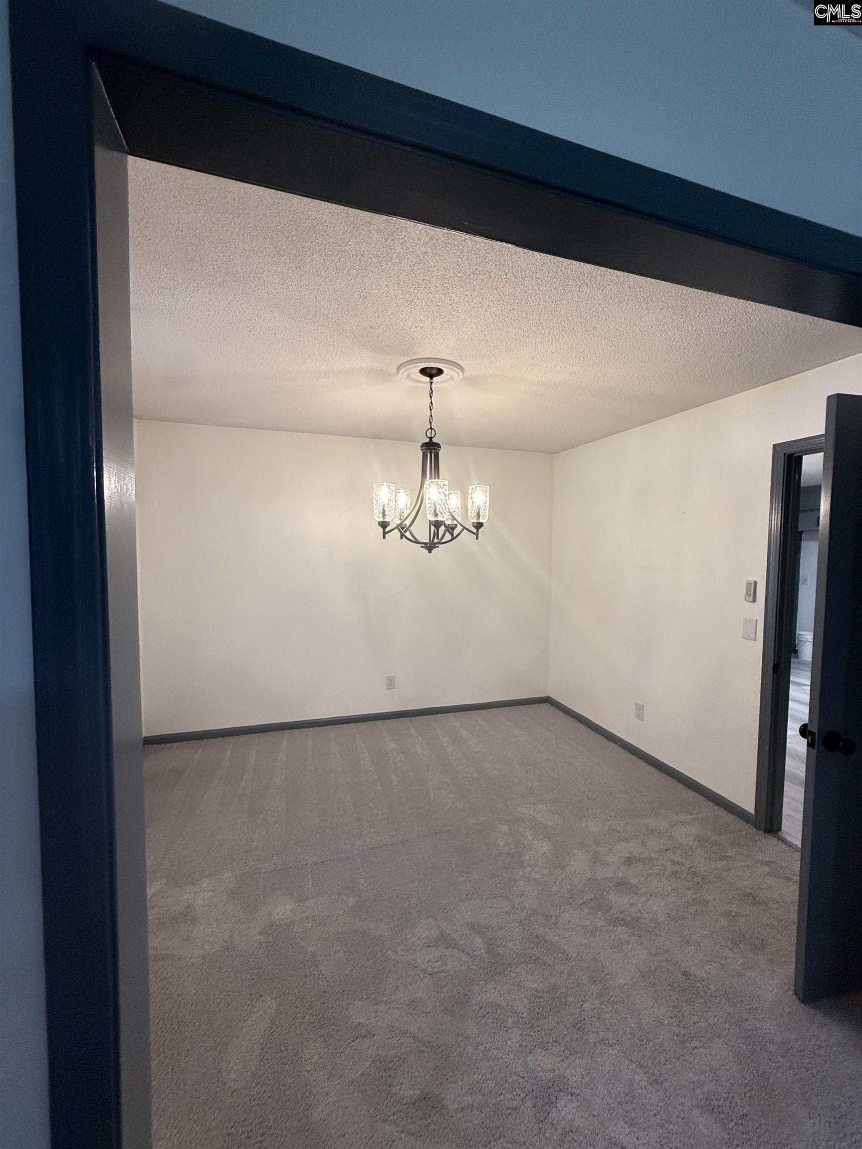 326 Townes Road Columbia, SC 29210 - Photo 8 of 25 a view of a room with a ceiling fan and wooden floor