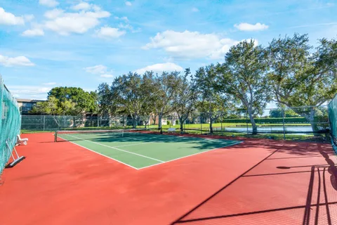 a living room with lots of furniture and a wooden floor