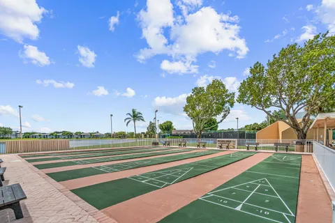 a view of a swimming pool with a yard