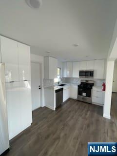 73 MacArthur Avenue, Unit 1 Lodi, NJ 07644 - Photo 2 of 15 a kitchen with granite countertop a refrigerator and a stove