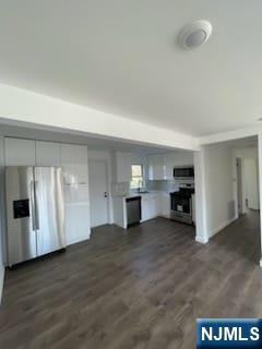 73 MacArthur Avenue, Unit 1 Lodi, NJ 07644 - Photo 3 of 15 a view of a kitchen with a sink and cabinets