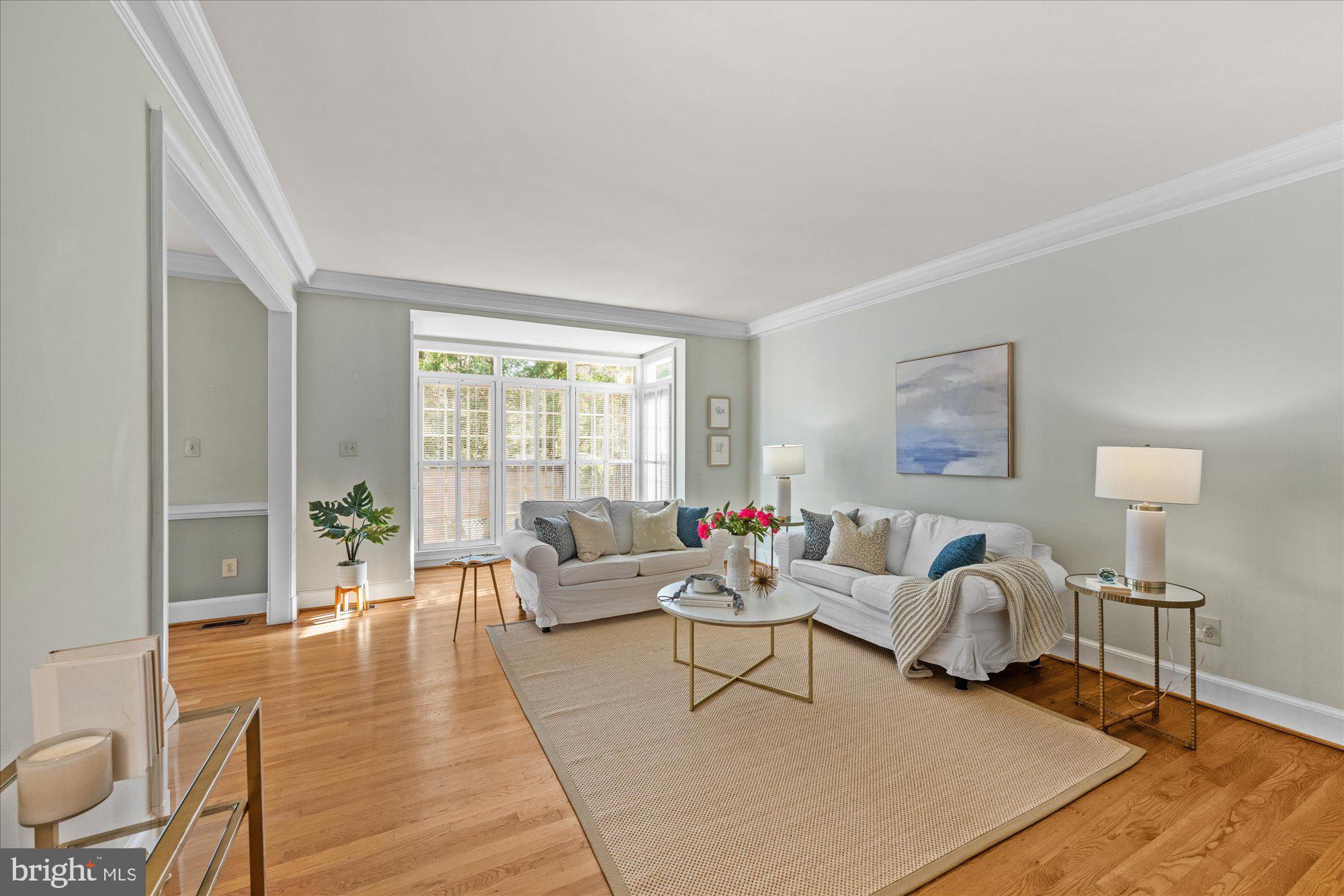 8025 Rising Ridge Road Bethesda, MD 20817 - Photo 11 of 34 a living room with furniture and a large window