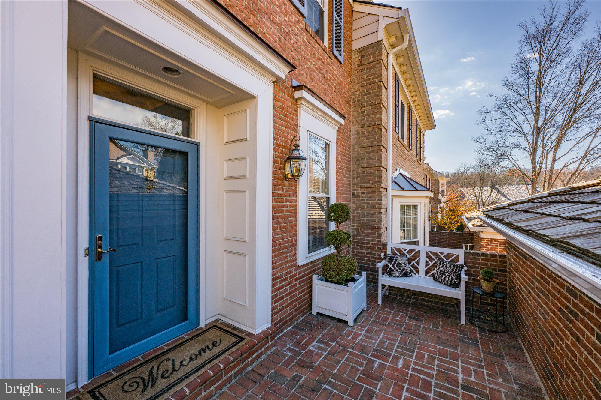 8025 Rising Ridge Road Bethesda, MD 20817 - Photo 2 of 34 a view of a porch with furniture and floor to ceiling window