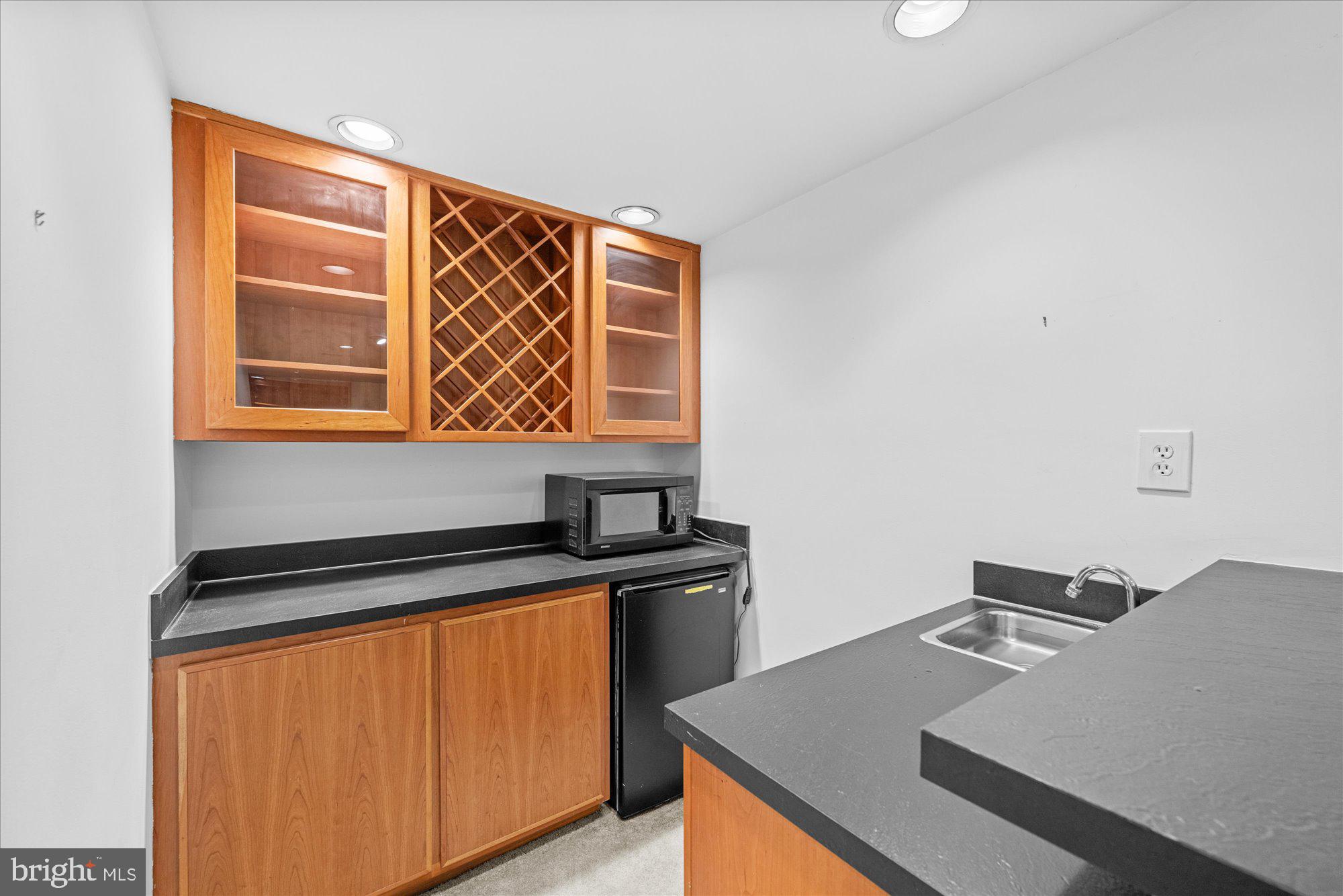 8025 Rising Ridge Road Bethesda, MD 20817 - Photo 26 of 34 a kitchen with a sink a stove and a window