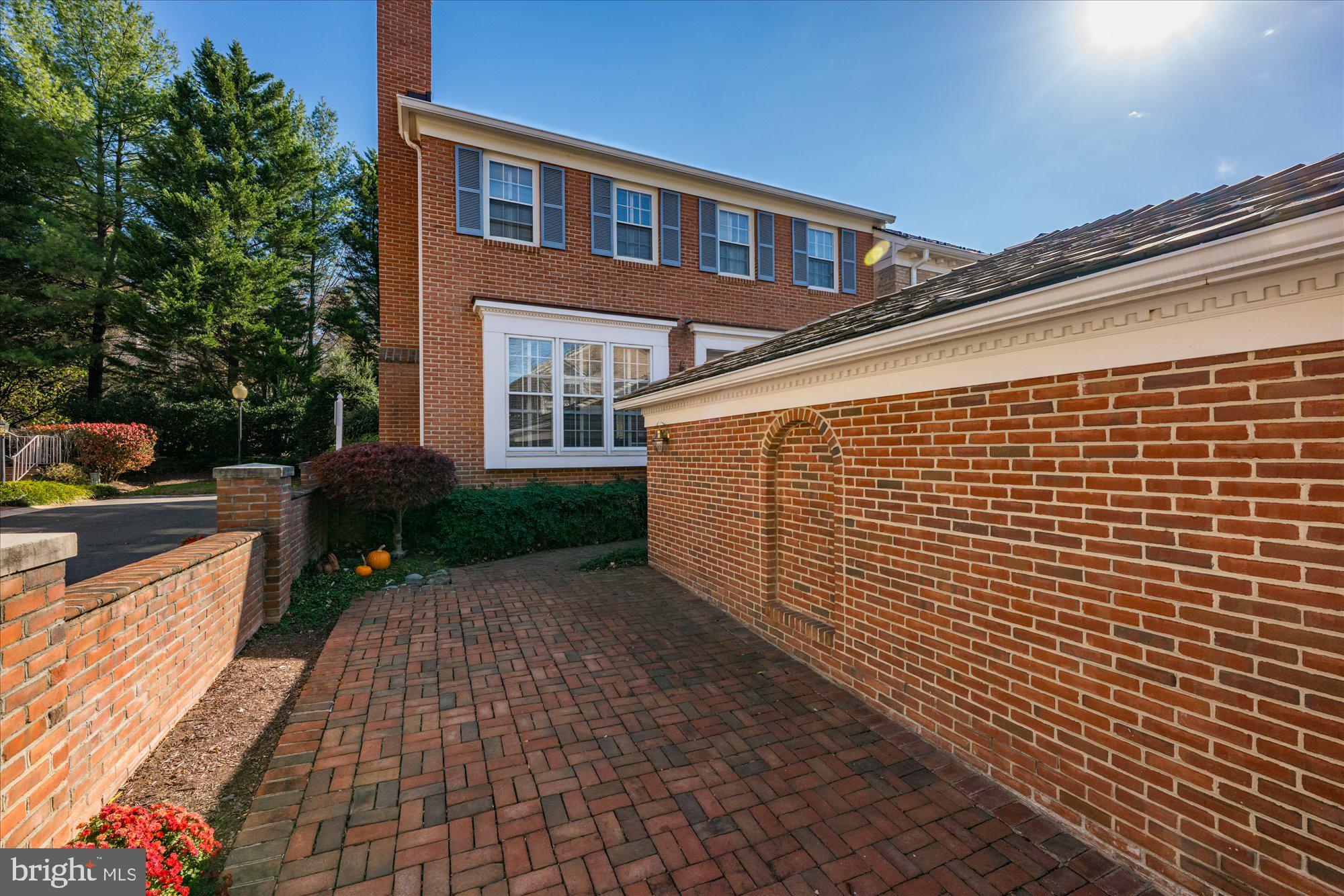 8025 Rising Ridge Road Bethesda, MD 20817 - Photo 33 of 34 a front view of a house with a yard
