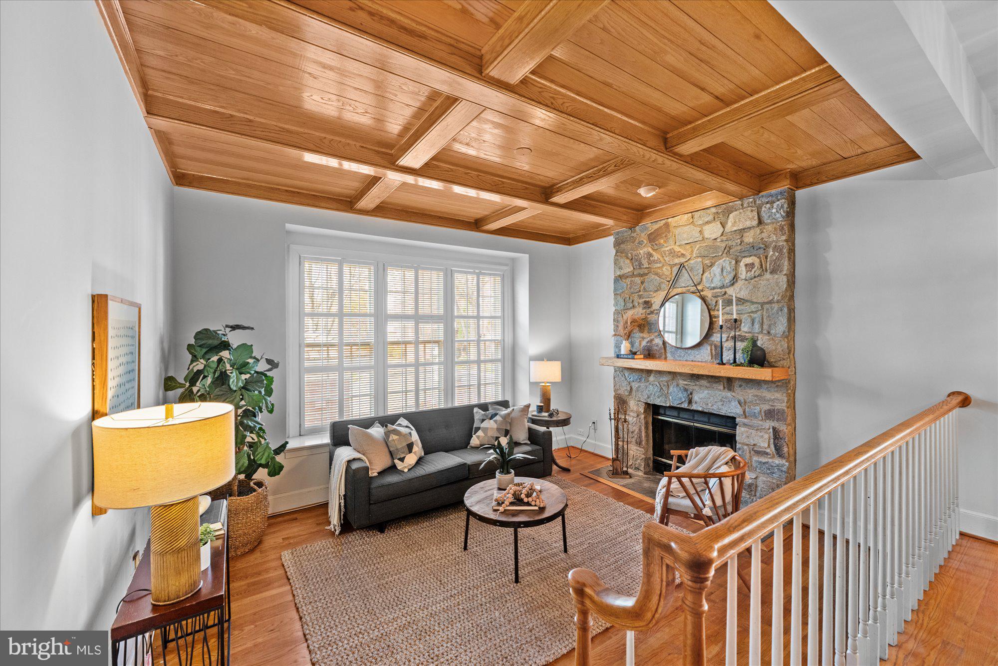 8025 Rising Ridge Road Bethesda, MD 20817 - Photo 4 of 34 a living room with furniture and a fireplace