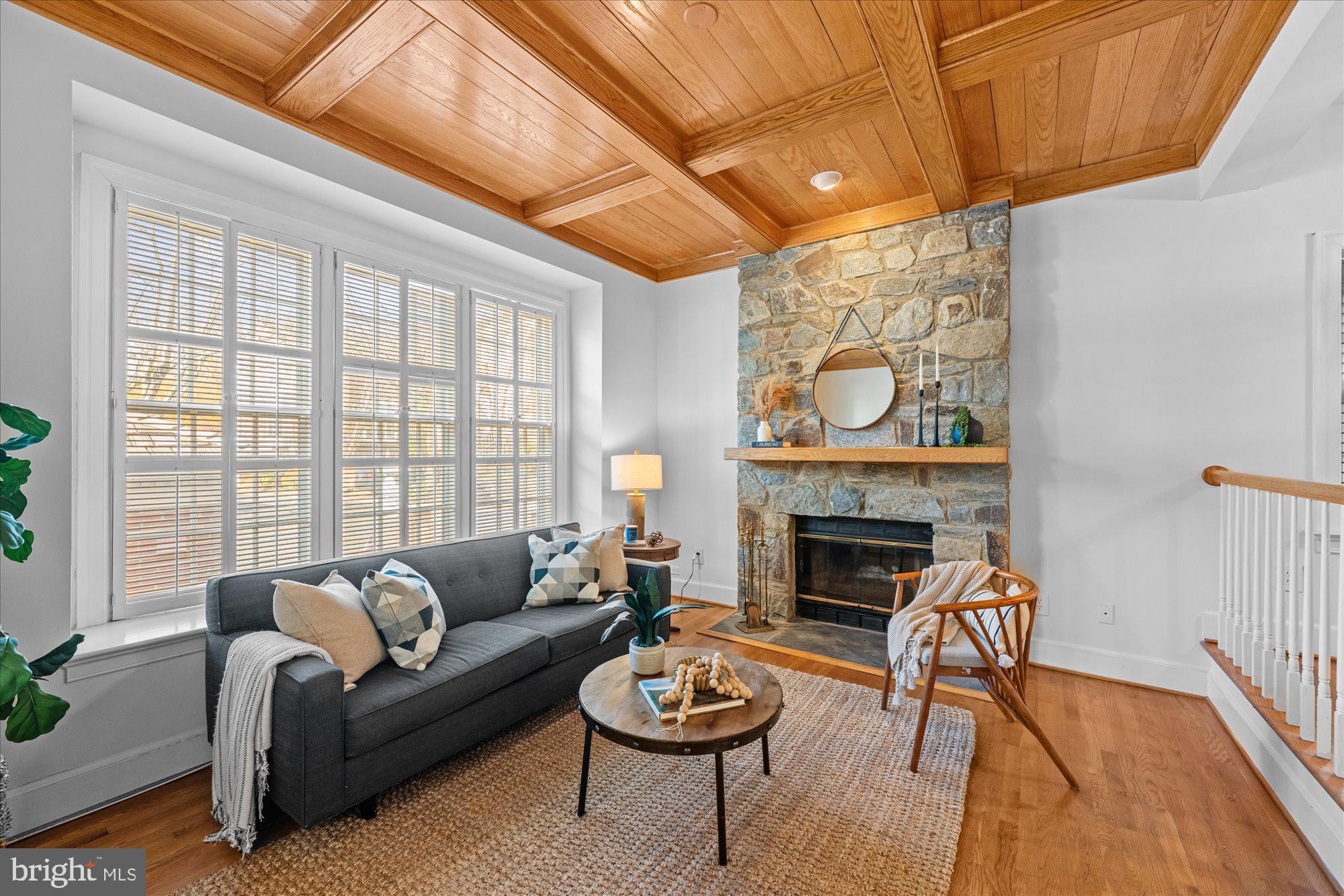8025 Rising Ridge Road Bethesda, MD 20817 - Photo 5 of 34 a living room with furniture a fireplace and a large window