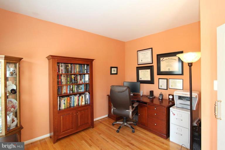 18409 Cornflower Road Boyds, MD 20841 - Photo 2 of 24 a view of a workspace with wooden floor and a window