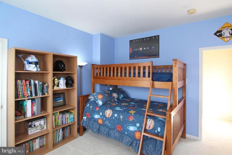 18409 Cornflower Road Boyds, MD 20841 - Photo 11 of 24 a view of a book shelf in a room