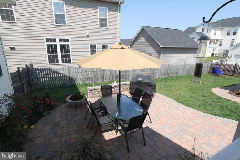 18409 Cornflower Road Boyds, MD 20841 - Photo 13 of 24 a view of a house with backyard and sitting area