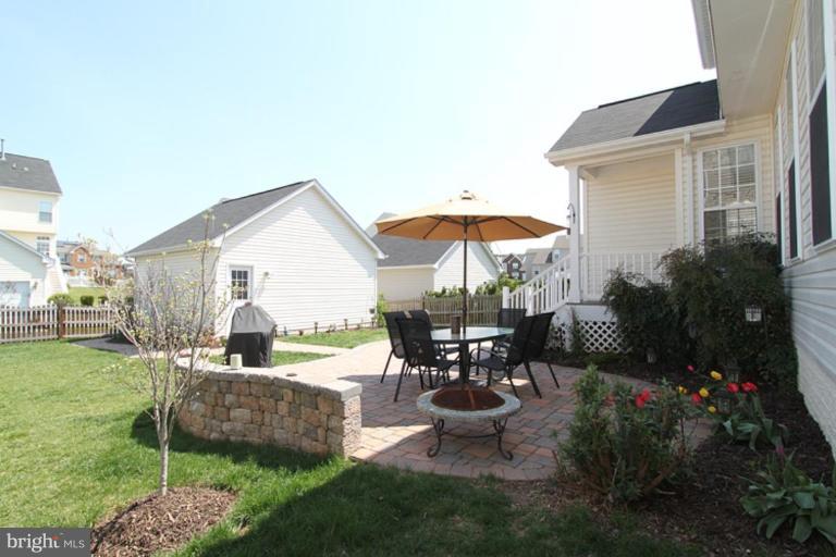 18409 Cornflower Road Boyds, MD 20841 - Photo 14 of 24 a view of outdoor sitting area with furniture and garden