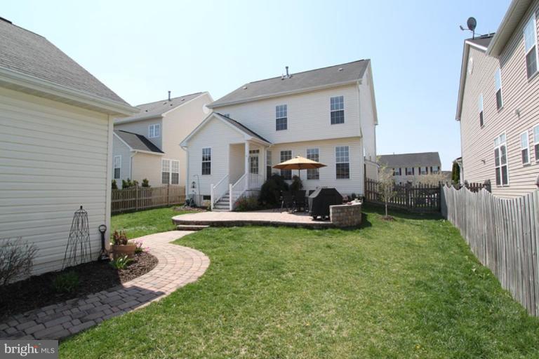 18409 Cornflower Road Boyds, MD 20841 - Photo 15 of 24 a view of a house with a yard deck and a small cabin