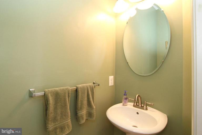 18409 Cornflower Road Boyds, MD 20841 - Photo 17 of 24 a bathroom with a sink and a mirror