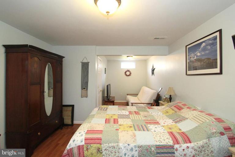 18409 Cornflower Road Boyds, MD 20841 - Photo 23 of 24 a bedroom with a bed and a mirror