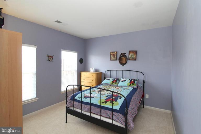 18409 Cornflower Road Boyds, MD 20841 - Photo 9 of 24 a bedroom with bed and a window